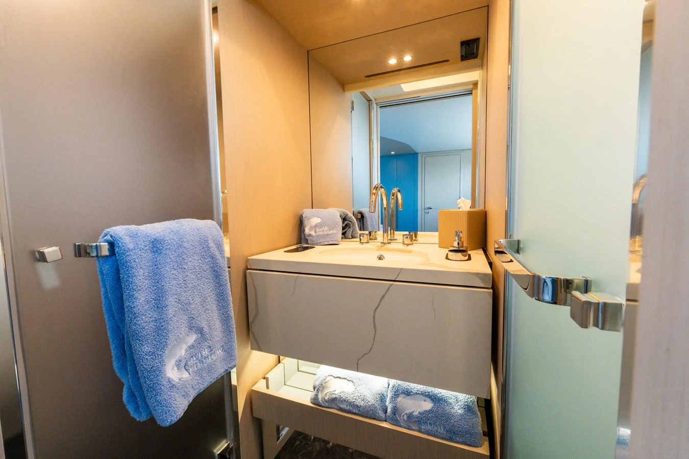 The yacht's bathroom features modern fixtures and plush towels. aboard GONE PHISHING Yacht for Sale