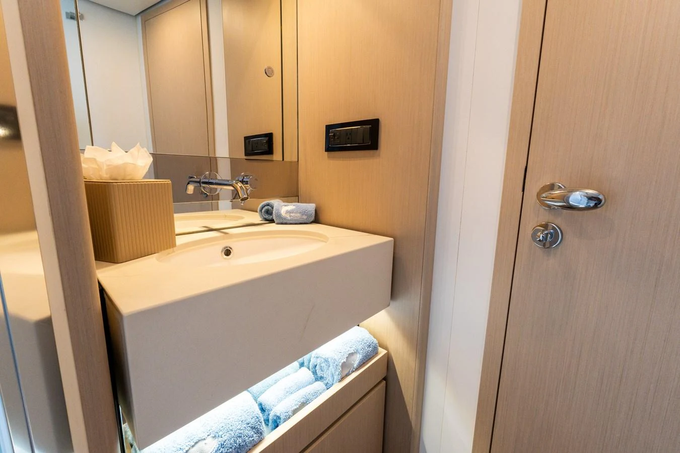 A modern yacht bathroom with sleek fixtures and ample storage. aboard GONE PHISHING Yacht for Sale