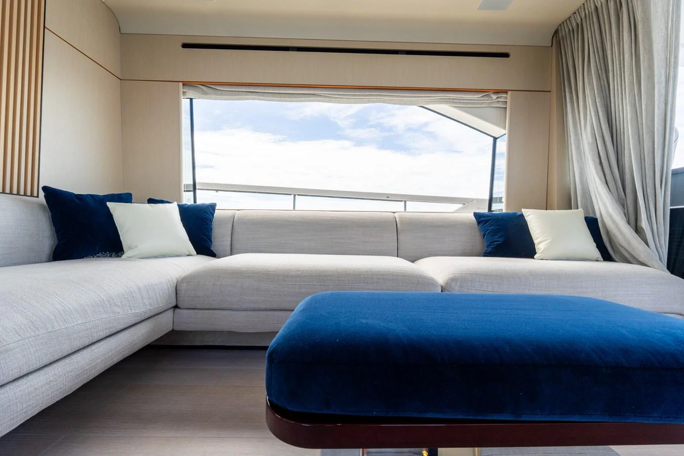 The salon features a spacious and comfortable seating area with large windows offering stunning views. aboard GONE PHISHING Yacht for Sale