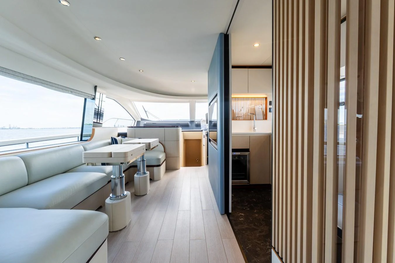 The salon features modern furnishings with ample natural light and a sleek design. aboard GONE PHISHING Yacht for Sale