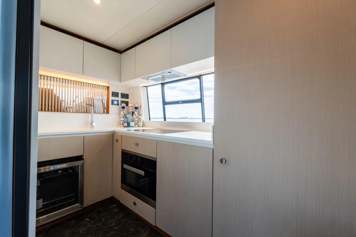 The yacht's galley features modern appliances and sleek cabinetry, offering a functional and stylish cooking space. aboard GONE PHISHING Yacht for Sale