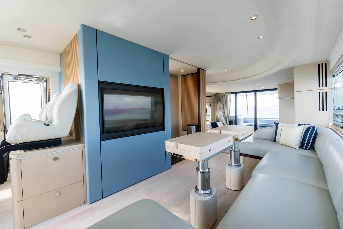 The salon features modern furnishings with ample seating and a large flat-screen TV. aboard GONE PHISHING Yacht for Sale