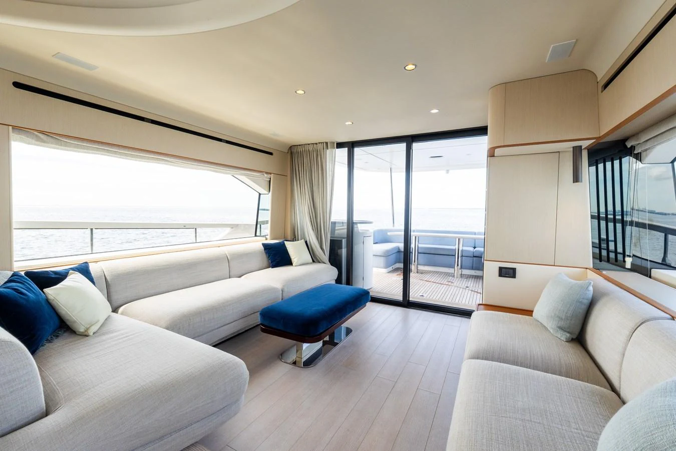 The salon features plush seating with panoramic views and access to the aft deck. aboard GONE PHISHING Yacht for Sale