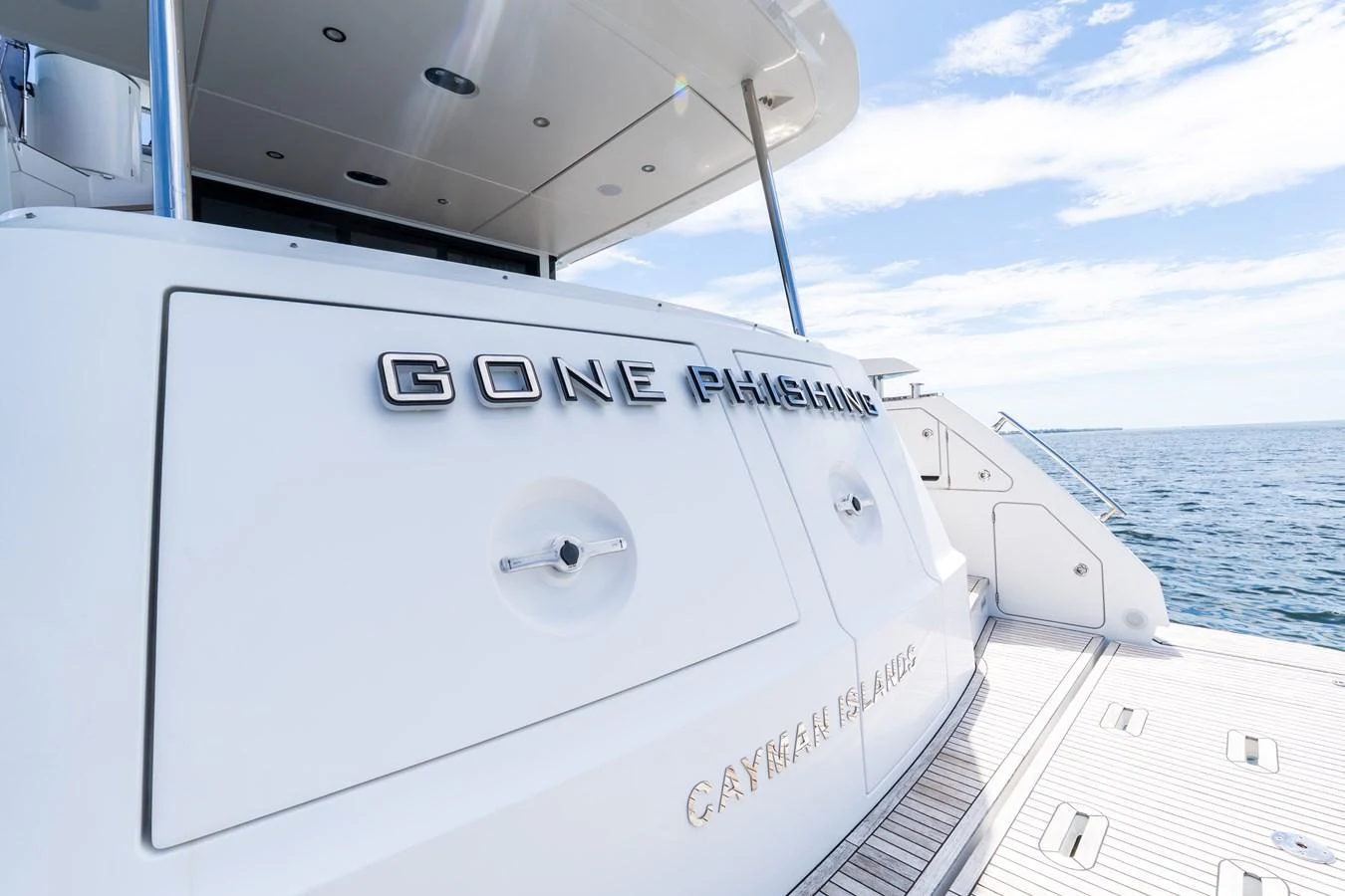 The aft deck of the yacht features sleek design elements and a spacious layout for relaxation. aboard GONE PHISHING Yacht for Sale