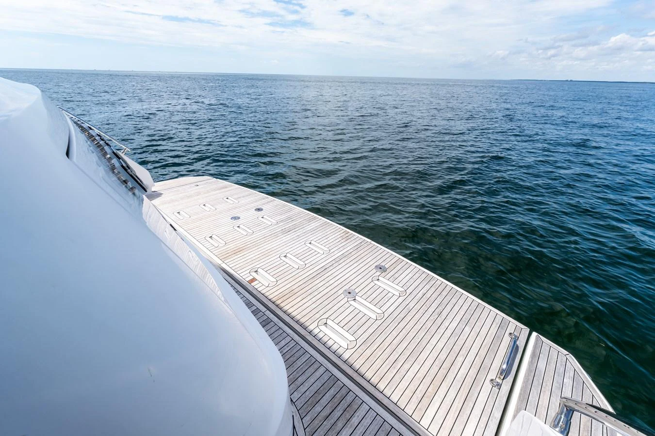 The yacht's aft deck offers a spacious and inviting area for relaxation with a stunning view of the open sea. aboard GONE PHISHING Yacht for Sale