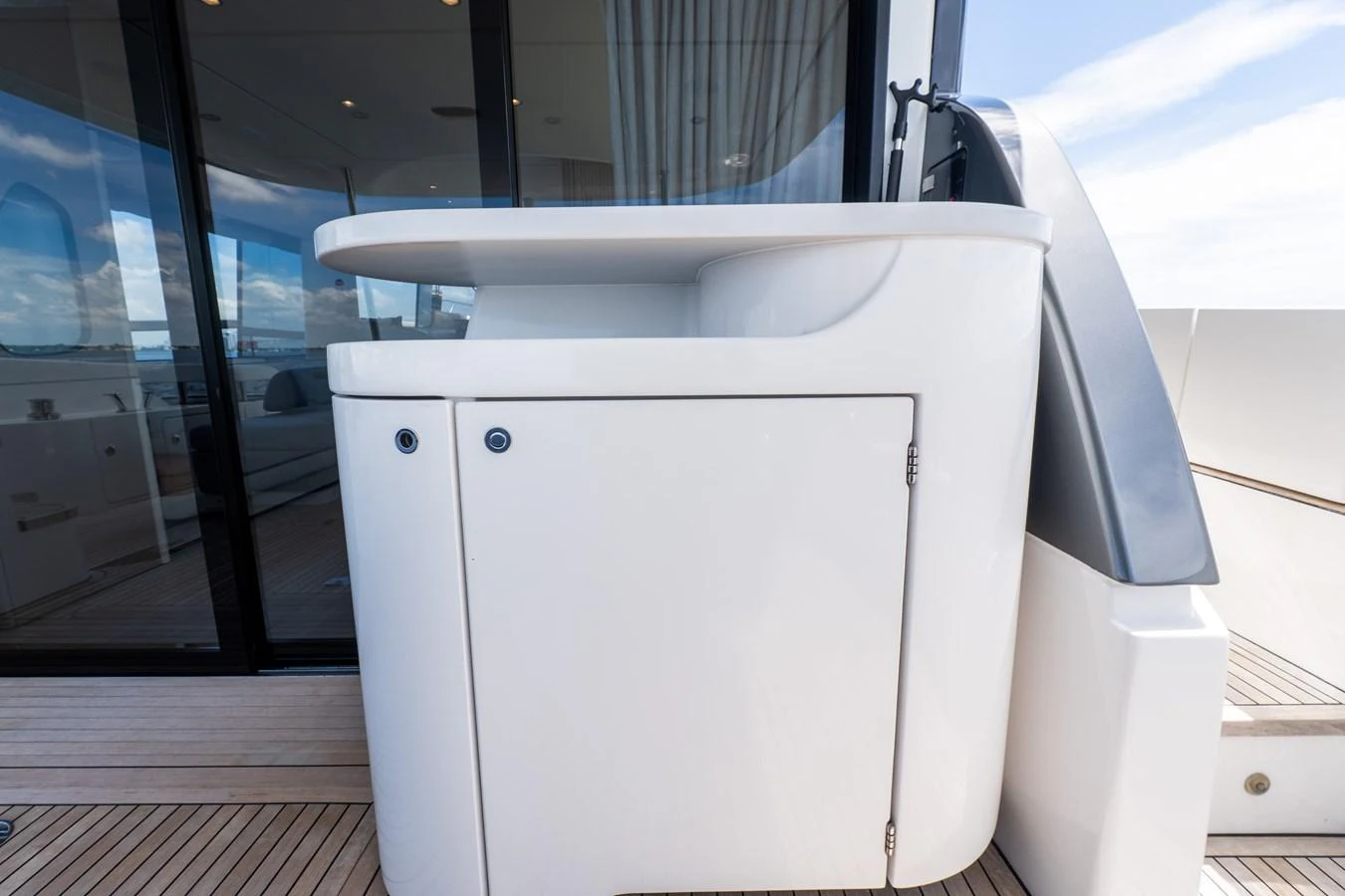 A sleek, modern outdoor bar area on the yacht's deck. aboard GONE PHISHING Yacht for Sale