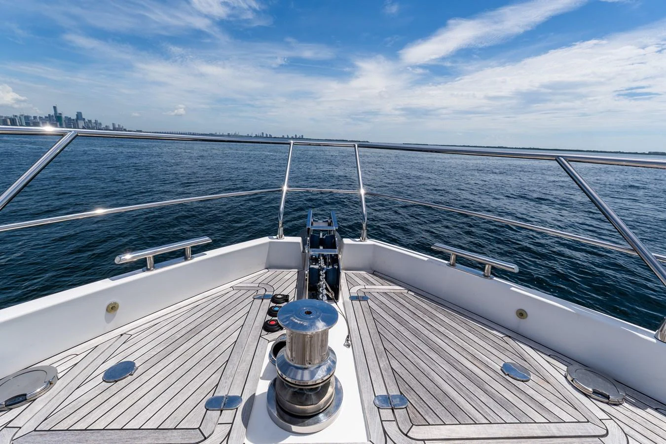 The bow of the yacht offers a stunning view of the open sea and distant skyline. aboard GONE PHISHING Yacht for Sale