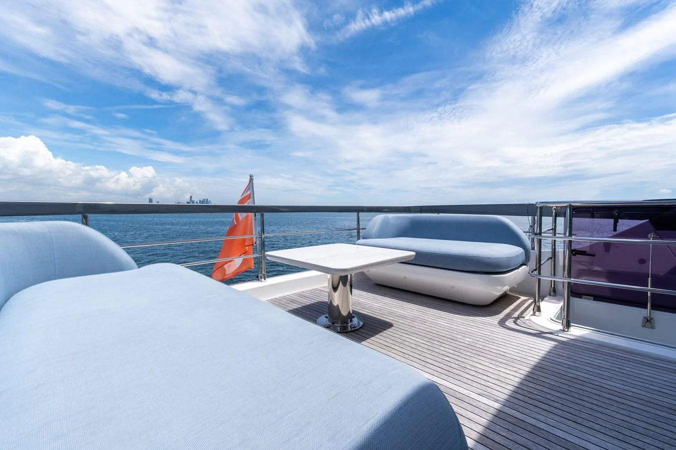 The sundeck offers a serene space with comfortable seating and a stunning ocean view. aboard GONE PHISHING Yacht for Sale