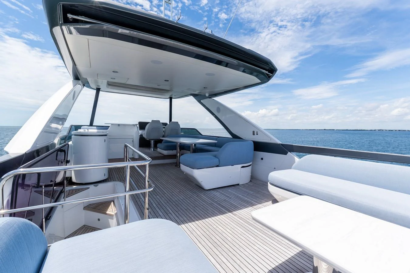 The flybridge offers a spacious and luxurious outdoor lounging area with ample seating and stunning ocean views. aboard GONE PHISHING Yacht for Sale