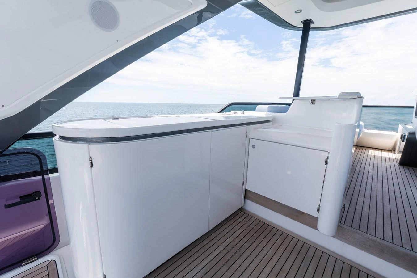 The flybridge features sleek, modern cabinetry and ample seating with a stunning ocean view. aboard GONE PHISHING Yacht for Sale