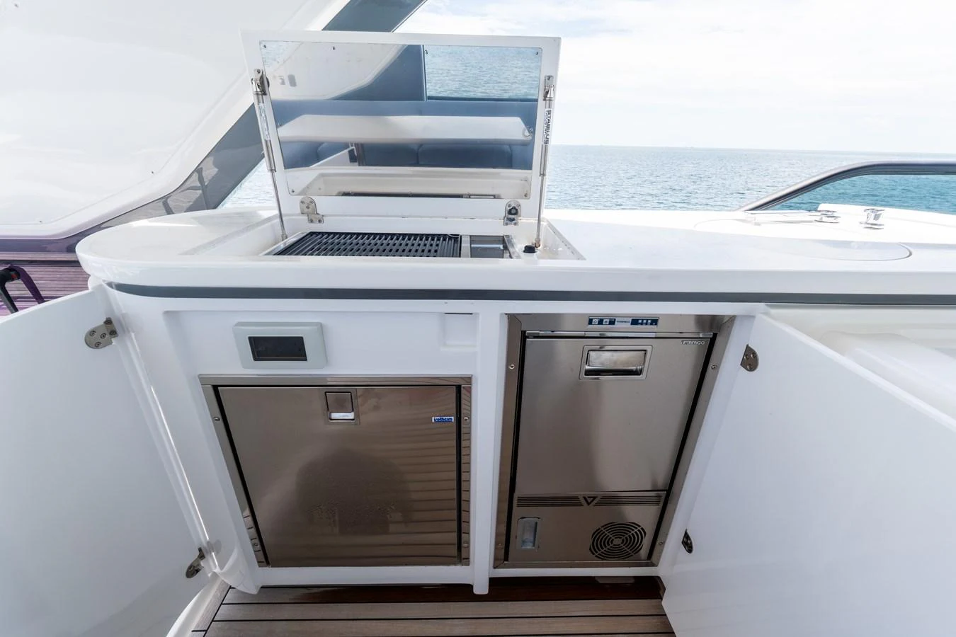 The yacht features a well-equipped outdoor galley with modern appliances and ample storage. aboard GONE PHISHING Yacht for Sale