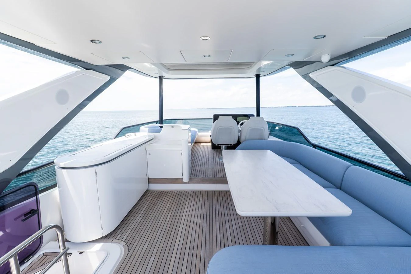The flybridge offers a spacious and modern seating area with panoramic ocean views. aboard GONE PHISHING Yacht for Sale