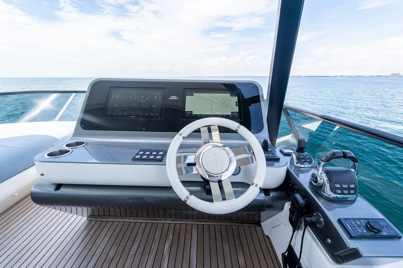 The helm station offers a sleek and modern control area with advanced navigation equipment. aboard GONE PHISHING Yacht for Sale