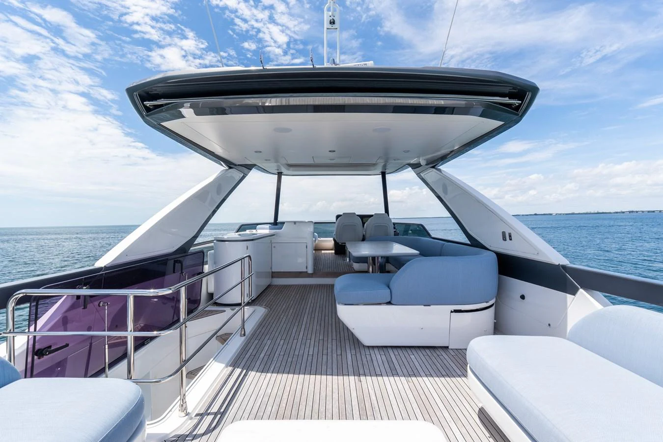 The flybridge offers a spacious and luxurious outdoor lounging area with comfortable seating and stunning sea views. aboard GONE PHISHING Yacht for Sale