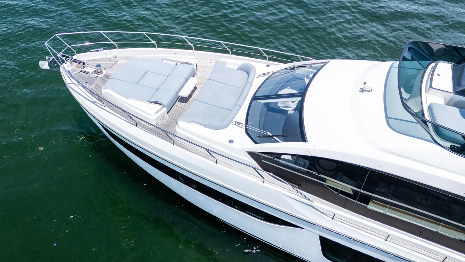 A sleek and modern yacht glides gracefully on the water, showcasing its elegant design and spacious deck. aboard GONE PHISHING Yacht for Sale