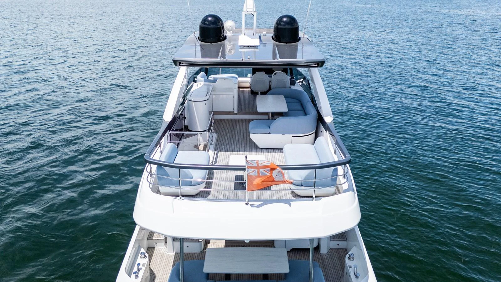The yacht's flybridge offers a spacious and luxurious area for relaxation and entertainment with ample seating and stunning views of the water. aboard GONE PHISHING Yacht for Sale