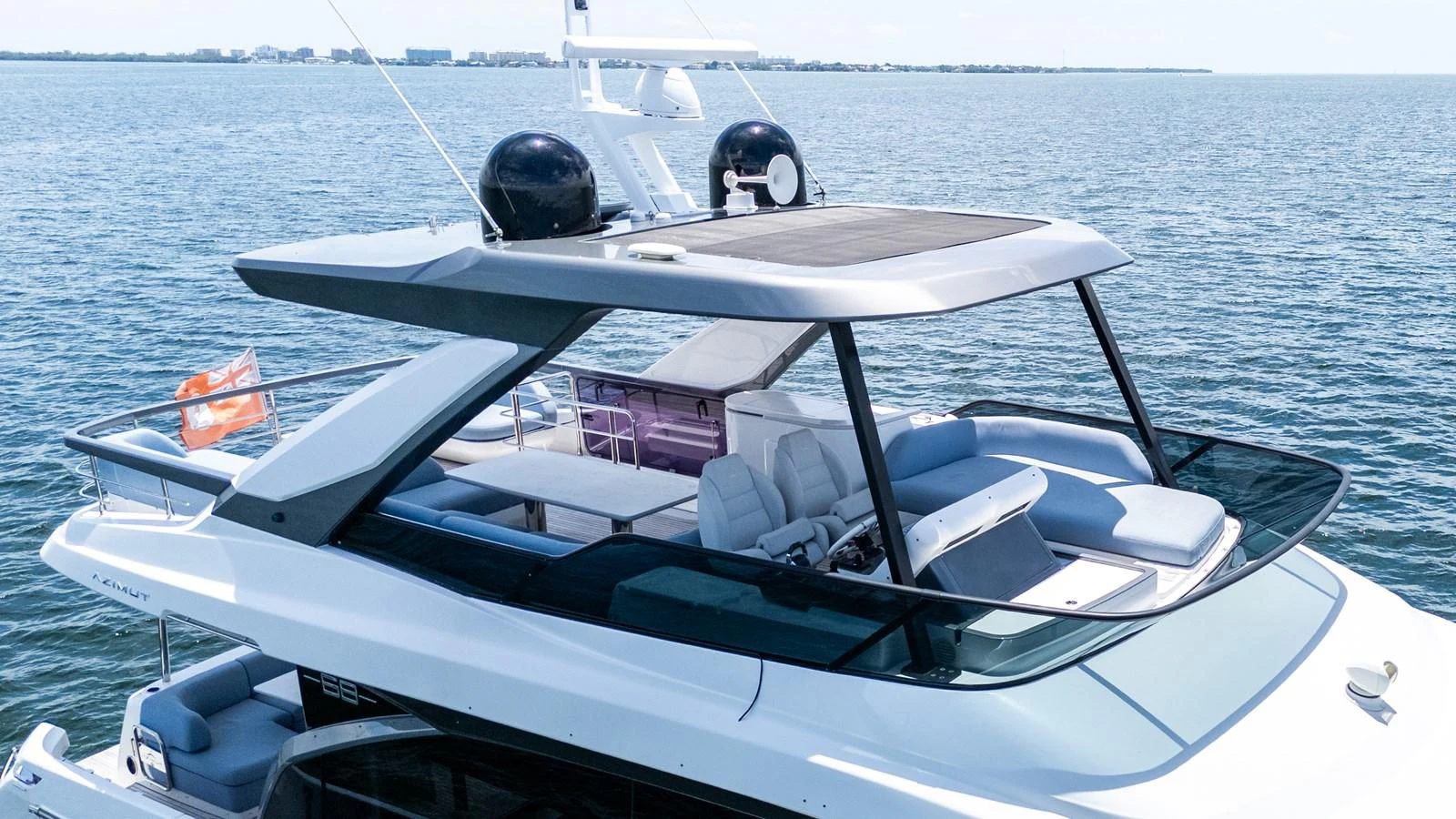 The yacht's flybridge offers a luxurious outdoor seating area with panoramic ocean views. aboard GONE PHISHING Yacht for Sale