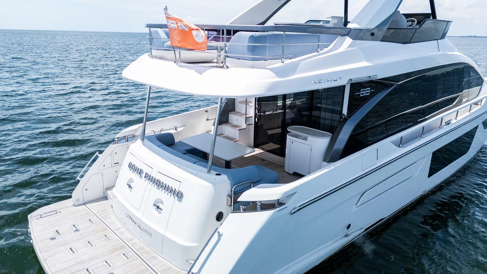 The yacht's sleek aft deck offers a luxurious space for relaxation and enjoyment on the water. aboard GONE PHISHING Yacht for Sale