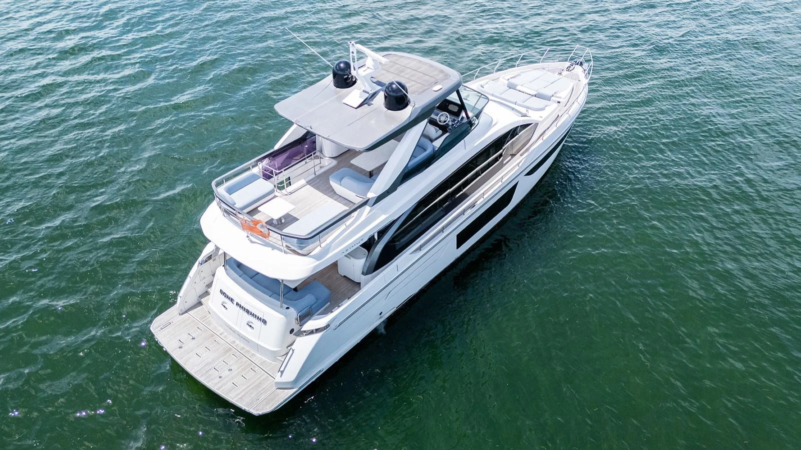 A sleek and modern yacht cruising gracefully on the water. aboard GONE PHISHING Yacht for Sale