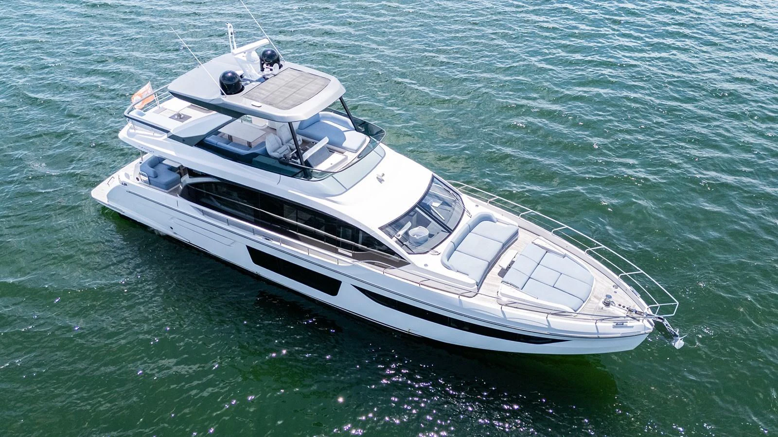 A sleek and modern yacht cruising on calm waters. aboard GONE PHISHING Yacht for Sale