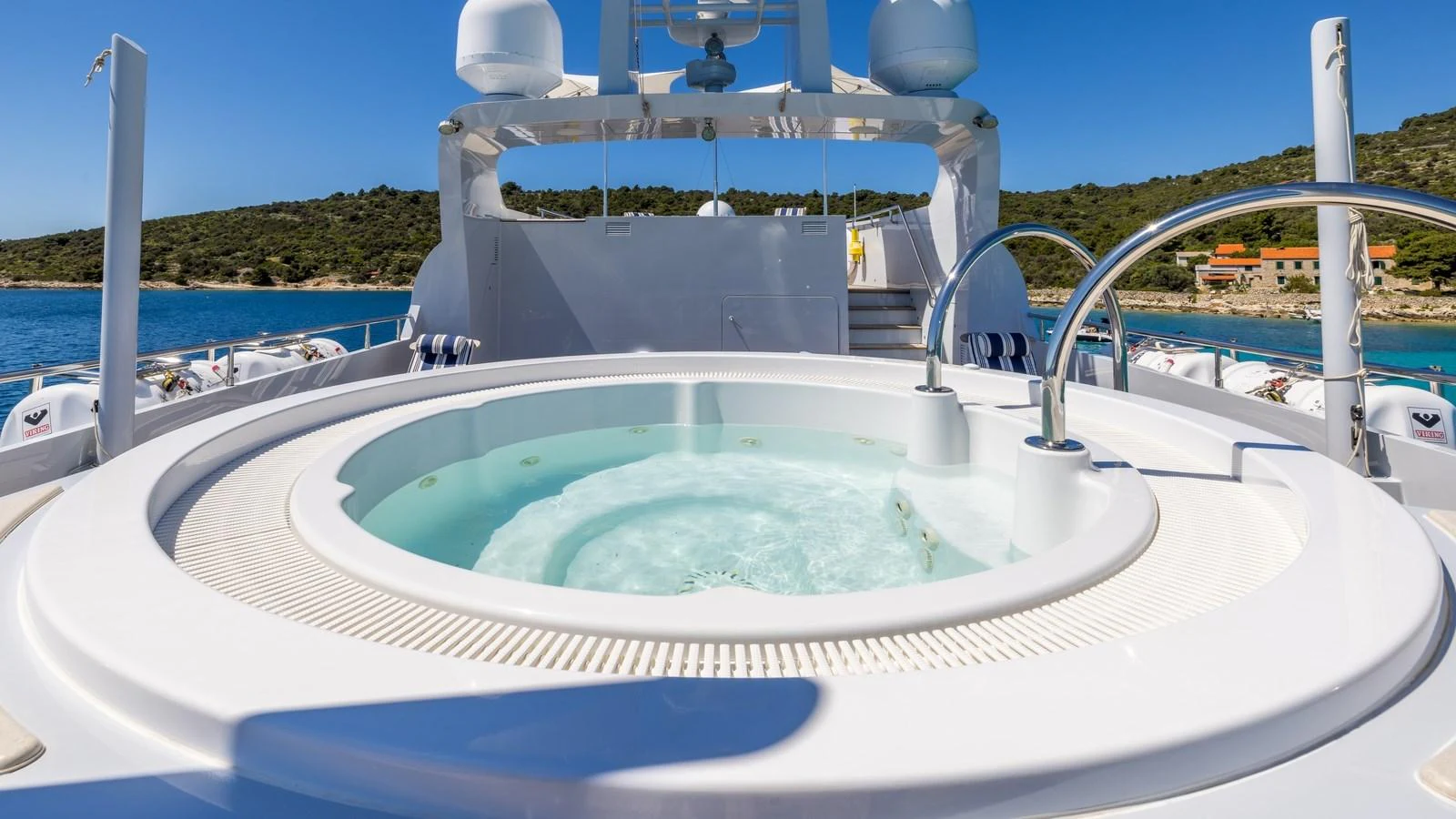 The sundeck features a luxurious jacuzzi with stunning views of the surrounding waters. aboard LA STELLA DEI MARI Yacht for Sale