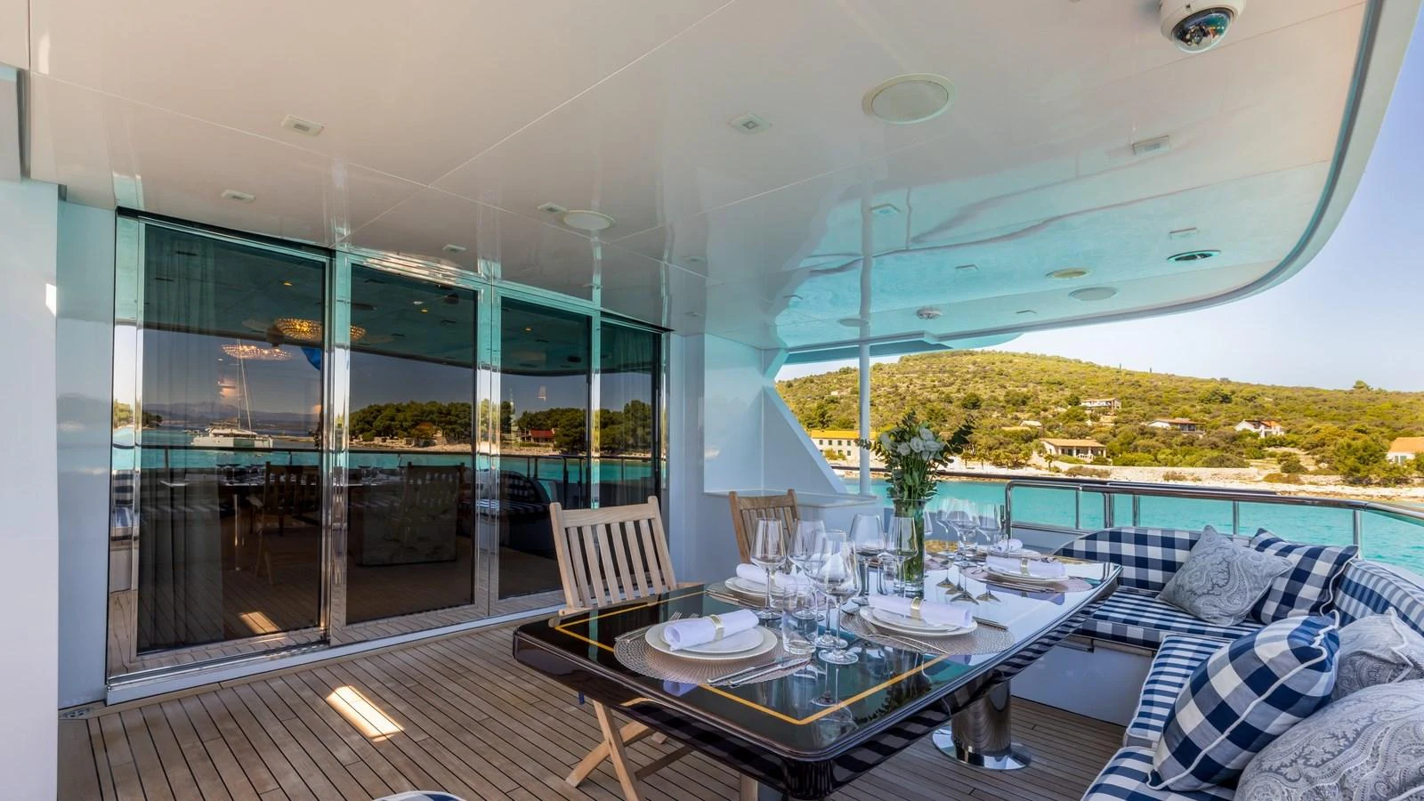 The aft deck offers a luxurious dining area with a stunning view of the surrounding waters. aboard LA STELLA DEI MARI Yacht for Sale