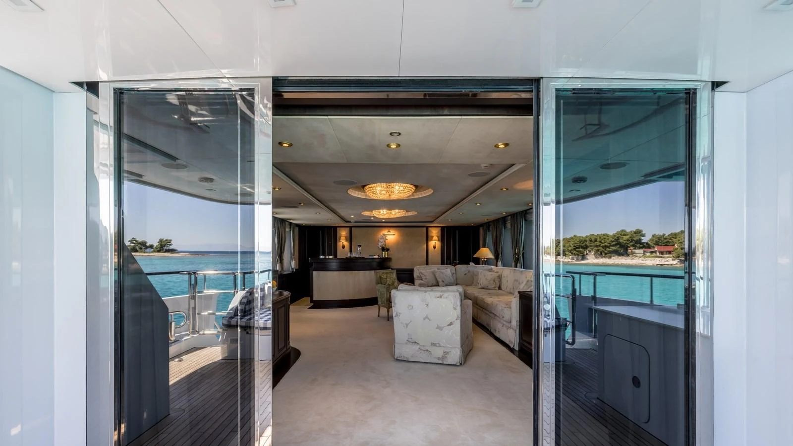 The salon offers a luxurious and inviting space with plush seating and expansive views of the surrounding waters. aboard LA STELLA DEI MARI Yacht for Sale