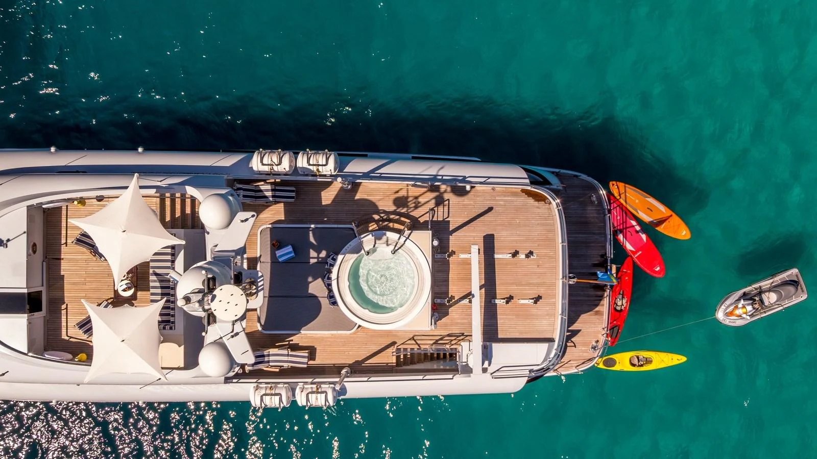 The yacht's sundeck features a luxurious hot tub and ample lounging space, perfect for relaxation. aboard LA STELLA DEI MARI Yacht for Sale