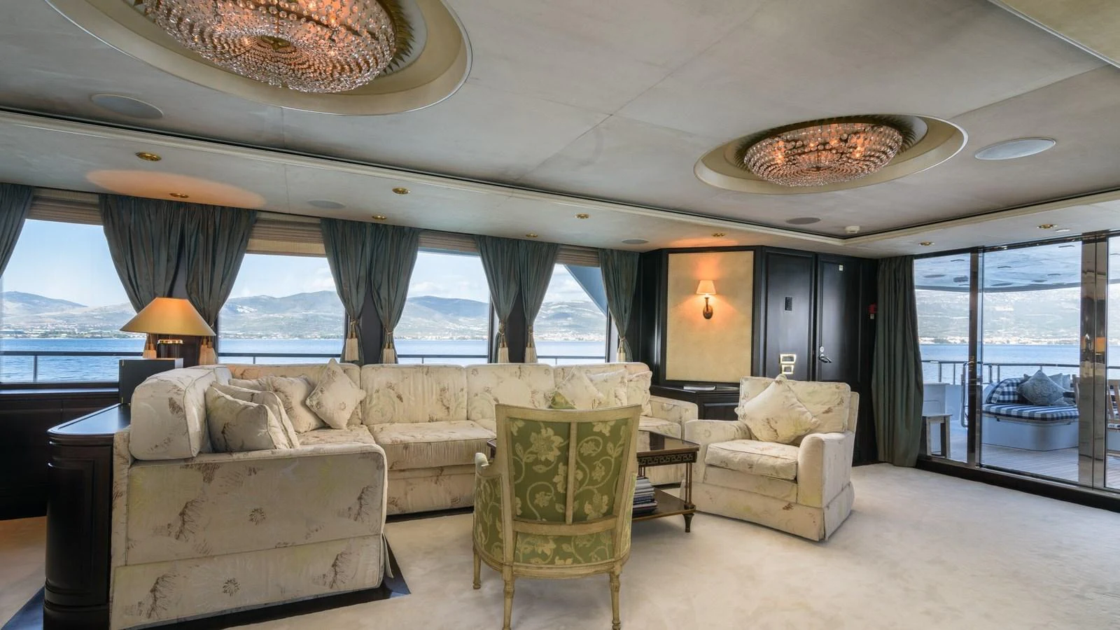 The salon features elegant furnishings and large windows offering stunning views. aboard LA STELLA DEI MARI Yacht for Sale
