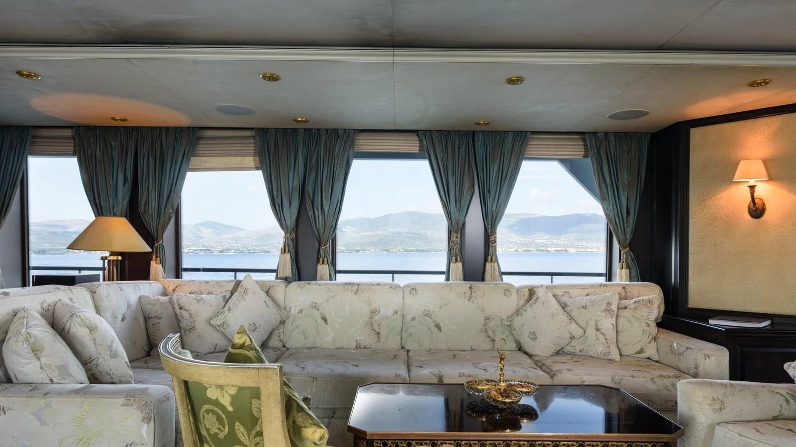 The salon features elegant furnishings with large windows offering stunning views. aboard LA STELLA DEI MARI Yacht for Sale