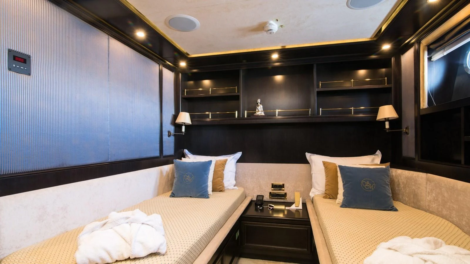 The guest stateroom features twin beds with elegant bedding and ambient lighting. aboard LA STELLA DEI MARI Yacht for Sale