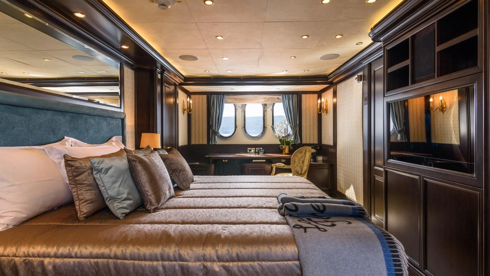 The master stateroom exudes luxury with its plush bedding, elegant woodwork, and ample natural light. aboard LA STELLA DEI MARI Yacht for Sale