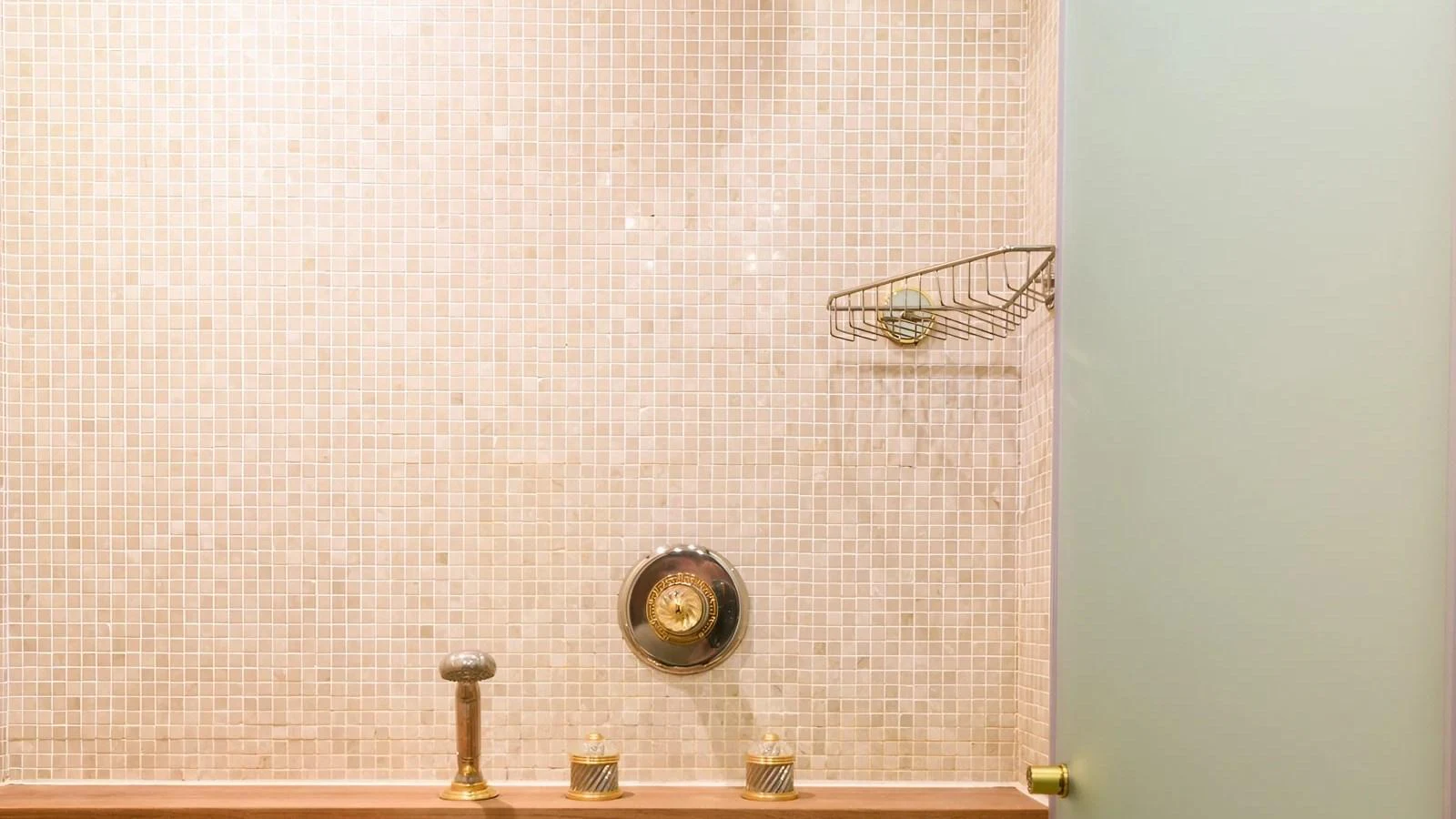 A close-up view of a yacht's shower area with elegant fixtures and a tiled wall. aboard LA STELLA DEI MARI Yacht for Sale