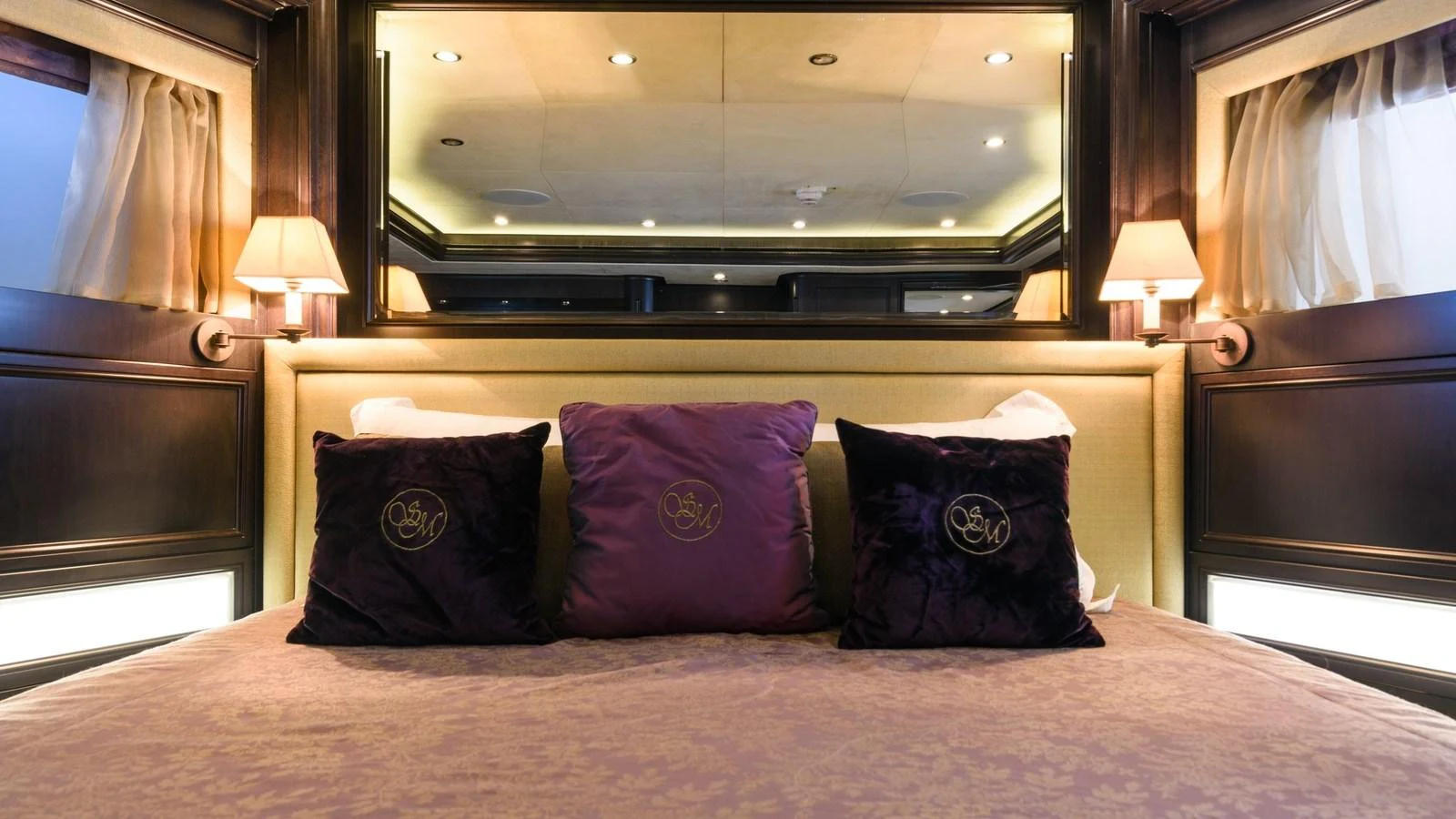 The stateroom features a plush bed with elegant pillows and ambient lighting. aboard LA STELLA DEI MARI Yacht for Sale