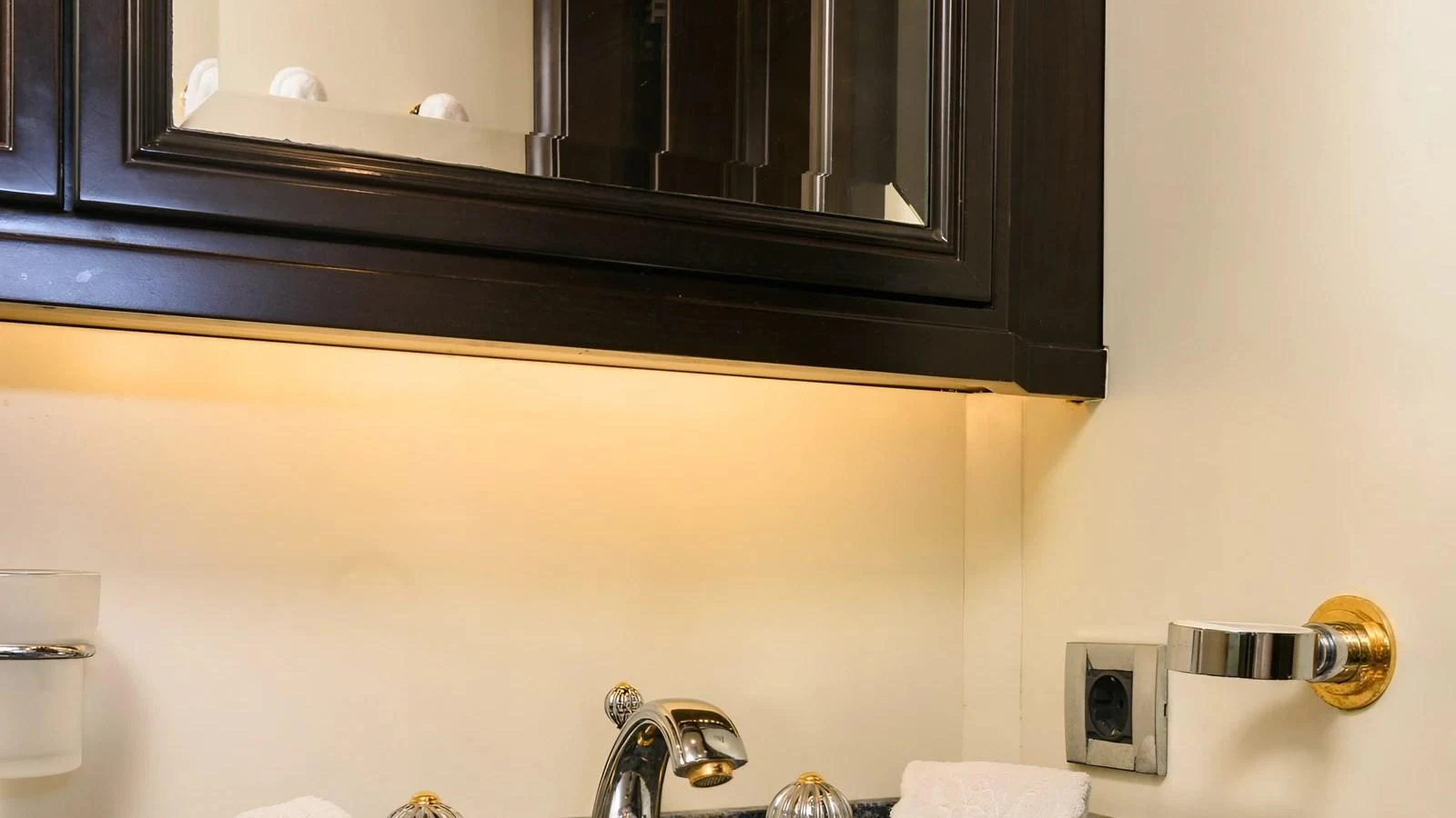 A close-up view of a yacht's bathroom sink area with elegant fixtures. aboard LA STELLA DEI MARI Yacht for Sale