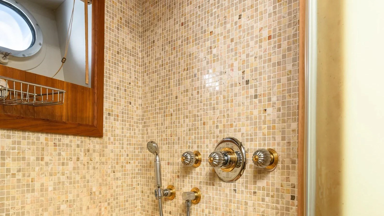 A luxurious shower area with elegant mosaic tiles and polished fixtures. aboard LA STELLA DEI MARI Yacht for Sale