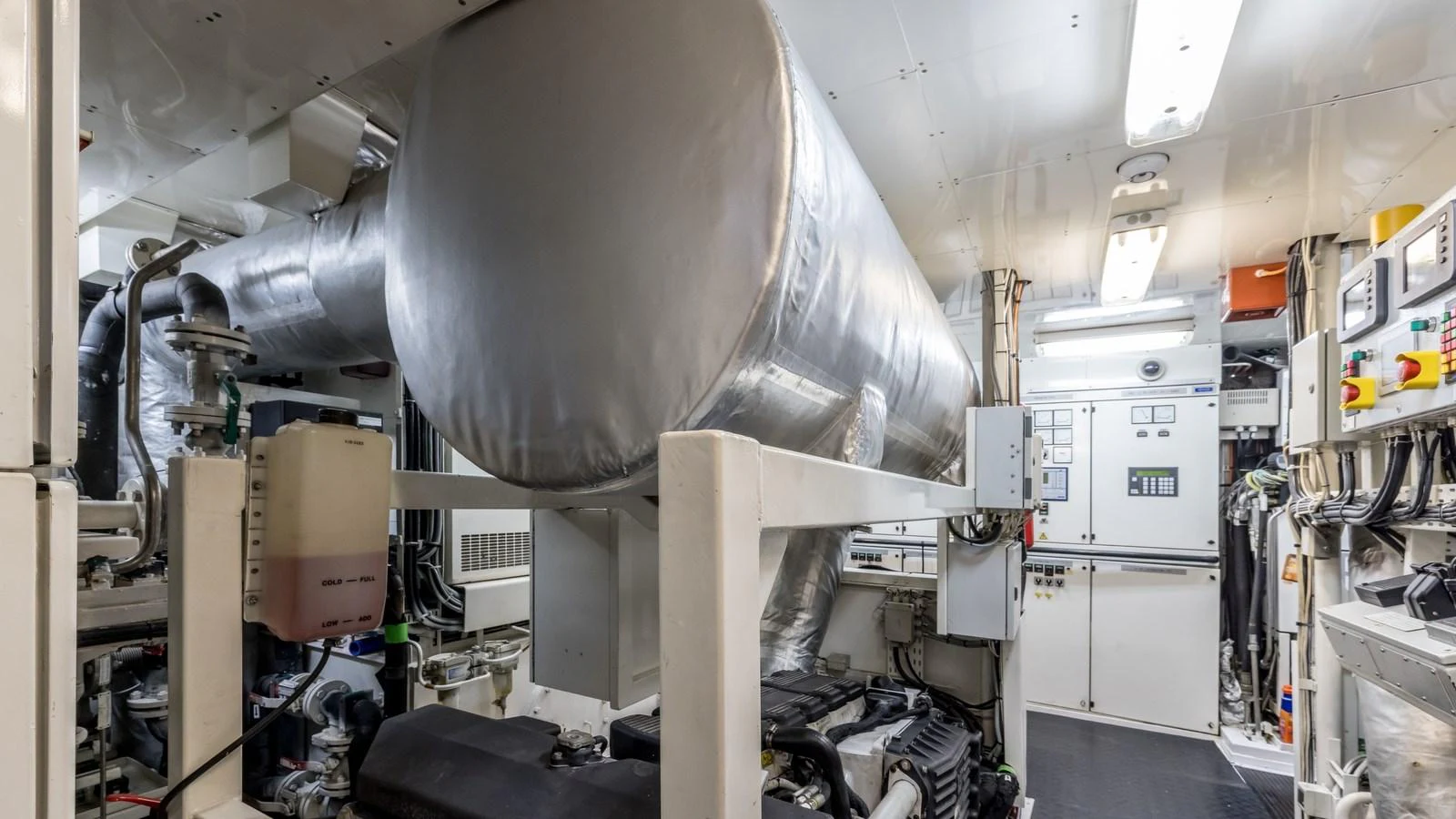 The engine room is meticulously organized, showcasing advanced machinery and control panels. aboard LA STELLA DEI MARI Yacht for Sale