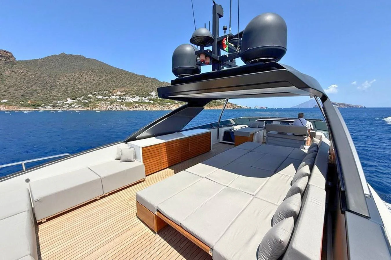 The spacious flybridge offers ample seating and lounging areas with stunning views of the surrounding waters. aboard CUT Yacht for Sale