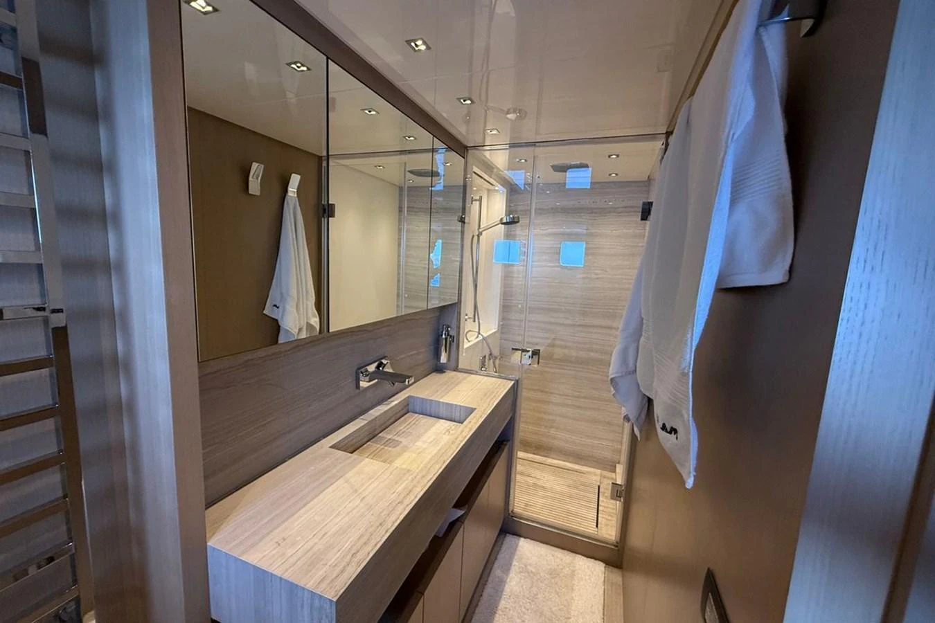 The yacht's bathroom features a sleek, modern design with a spacious shower and elegant fixtures. aboard CUT Yacht for Sale