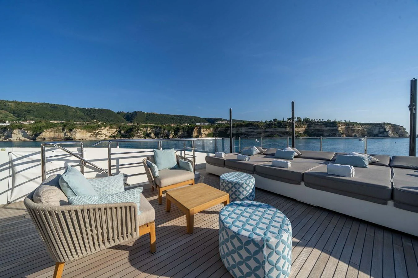 The sundeck offers a spacious and comfortable lounging area with stunning views of the surrounding landscape. aboard MR. T Yacht for Sale