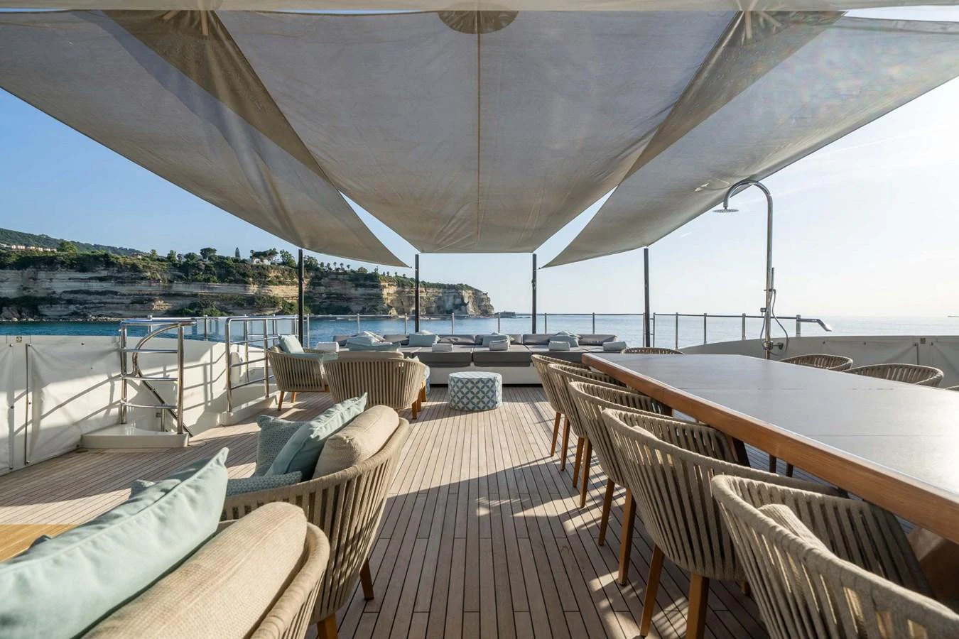 The sundeck offers a spacious and inviting area with ample seating and shade for relaxation and dining. aboard MR. T Yacht for Sale