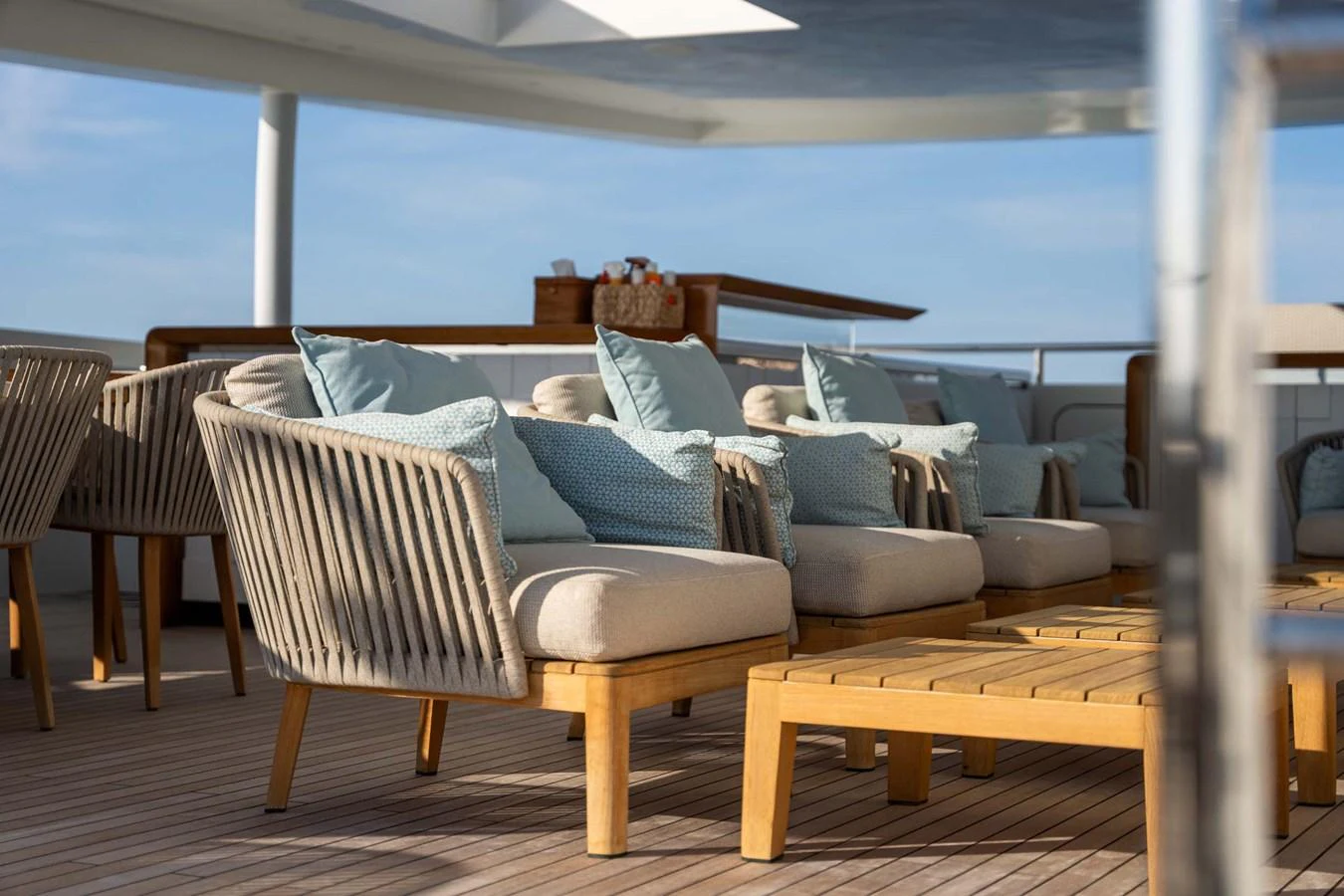 The sundeck features comfortable seating with plush cushions, perfect for relaxation under the open sky. aboard MR. T Yacht for Sale