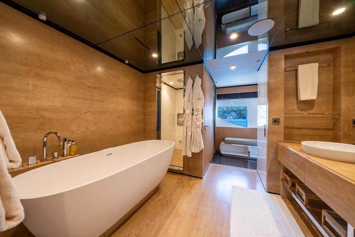 The yacht's bathroom features a luxurious freestanding tub and modern fixtures, creating a serene and elegant atmosphere. aboard MR. T Yacht for Sale