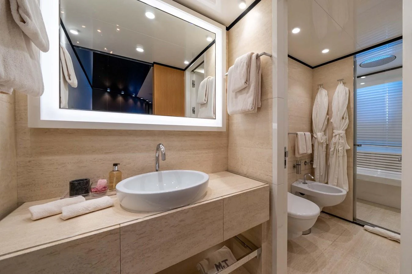 The yacht's bathroom features elegant fixtures and a modern design with luxurious amenities. aboard MR. T Yacht for Sale