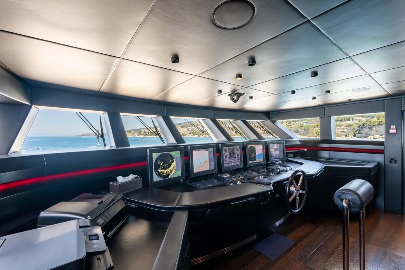 The helm features advanced navigation equipment and panoramic windows for optimal visibility. aboard MR. T Yacht for Sale