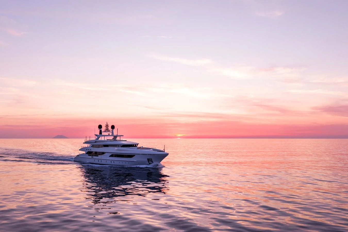 A sleek yacht cruises on calm waters against a stunning sunset backdrop. aboard MR. T Yacht for Sale