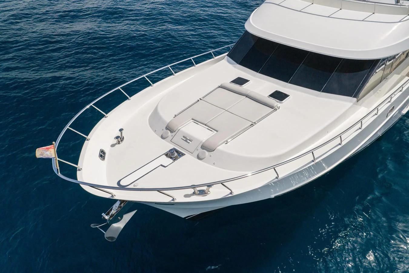 The yacht's sleek foredeck offers ample space for relaxation and sunbathing. aboard ABOAT TIME Yacht for Sale