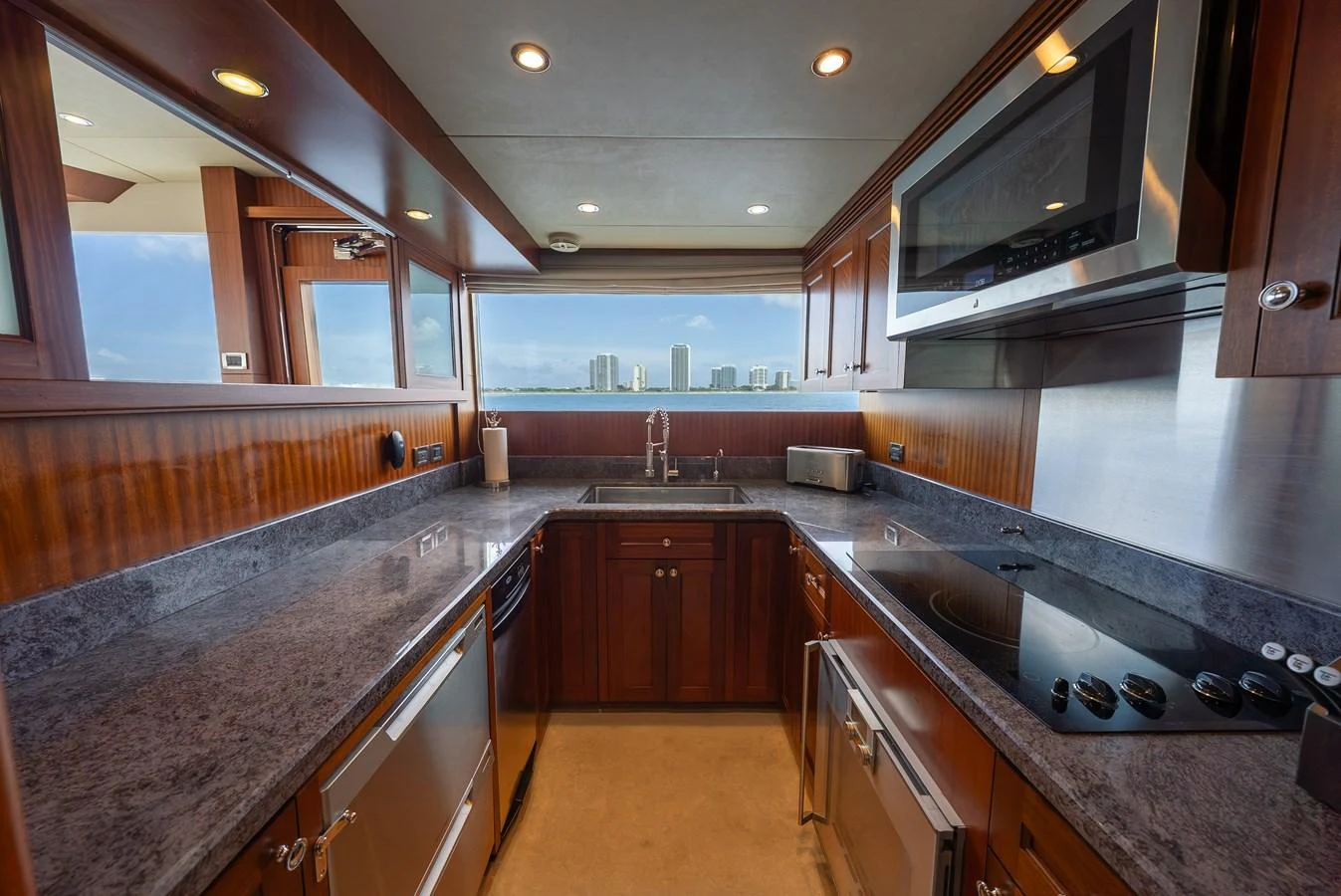 The galley features modern appliances and a sleek design with ample counter space. aboard ABOAT TIME Yacht for Sale