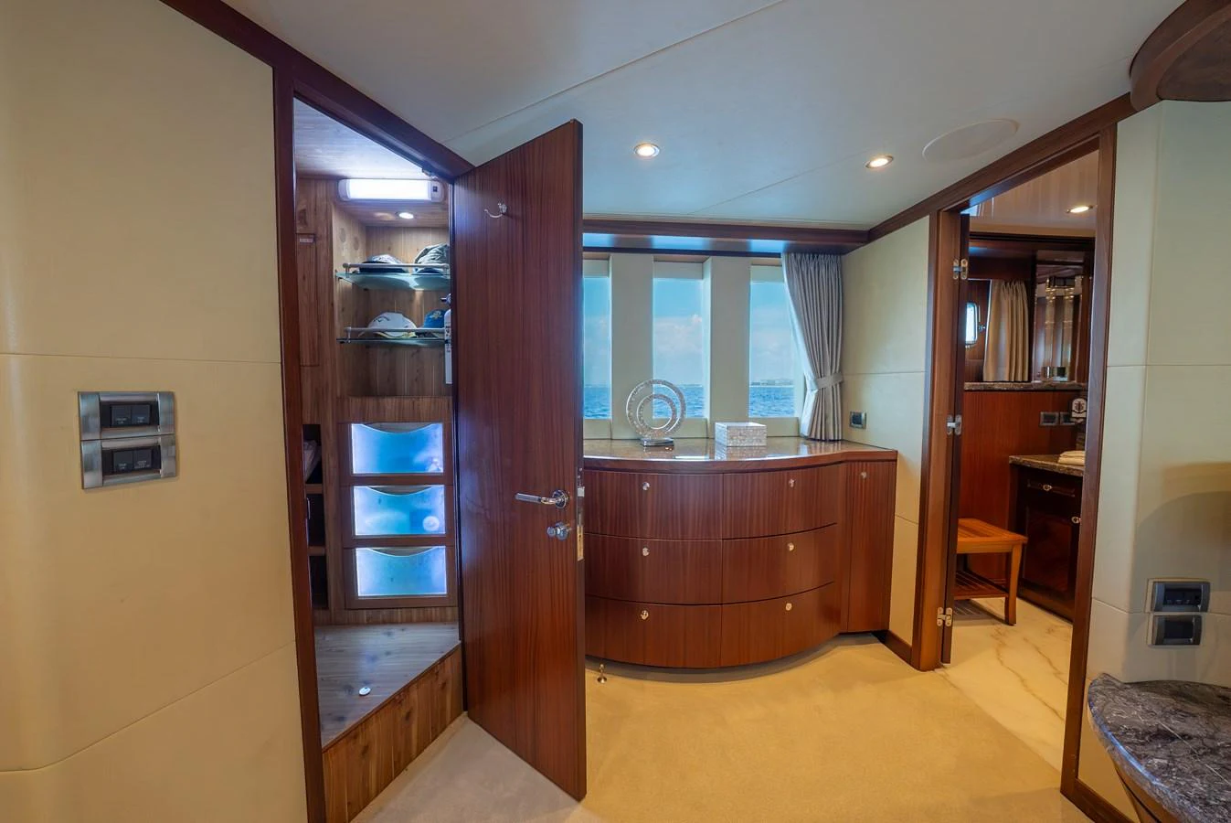The cabin features elegant wood finishes and ample natural light from the windows. aboard ABOAT TIME Yacht for Sale