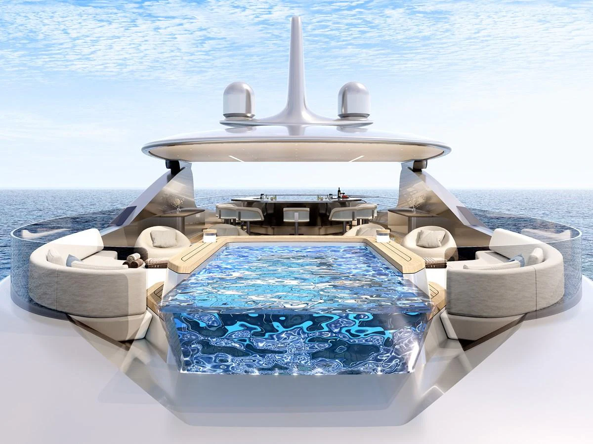 The sundeck features a luxurious pool surrounded by comfortable seating and a stunning ocean view. aboard LIVIA Yacht for Sale